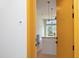 View of an apartment kitchen with modern pendant lighting and an island with granite countertop from the unit doorway at 600 S Duke St # 26, Durham, NC 27701