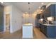 Bright kitchen showcasing stainless steel appliances, granite countertops, and adjacent bathroom at 600 S Duke St # 26, Durham, NC 27701