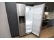 Stainless steel refrigerator with open doors providing ample space, storage, and convenience in this modern kitchen at 600 S Duke St # 26, Durham, NC 27701
