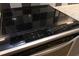 Close-up of a glass-top electric range with digital display and oven door showing the broiler element at 600 S Duke St # 26, Durham, NC 27701