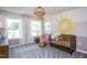 Bedroom with a crib and a calming color palette at 764 Denburn Pl, Raleigh, NC 27603