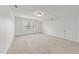 Bright bedroom with neutral carpeting and a large window at 102 Pinehill Way, Cary, NC 27513