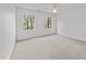Well-lit bedroom featuring neutral carpets and window with natural light at 102 Pinehill Way, Cary, NC 27513