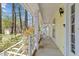 Inviting covered front porch with rocking chairs offering a relaxing outdoor space at 102 Pinehill Way, Cary, NC 27513