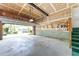 Spacious two car garage with cinder block walls and plenty of room for storage and a staircase at 102 Pinehill Way, Cary, NC 27513