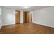 A comfortable bedroom with wood-look floors and ample closet space provides a relaxing and organized living area at 1705 Old Nc 10 Hwy, Hillsborough, NC 27278