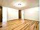 A bright, spacious bedroom with wood-look floors and neutral walls offers a serene retreat within the home at 1705 Old Nc 10 Hwy, Hillsborough, NC 27278
