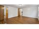 Bedroom with laminate wood flooring and a door leading to another room at 1705 Old Nc 10 Hwy, Hillsborough, NC 27278