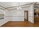 Bright dining room with chandelier and hardwood flooring adjacent to living spaces at 1705 Old Nc 10 Hwy, Hillsborough, NC 27278