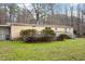 A home's exterior showcasing a deck and manicured landscaping, perfect for outdoor entertaining and relaxation at 1705 Old Nc 10 Hwy, Hillsborough, NC 27278