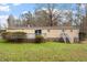 A charming home exterior featuring a deck, stairs, and a well-maintained yard, creating an inviting outdoor space at 1705 Old Nc 10 Hwy, Hillsborough, NC 27278