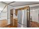 Kitchen view highlighting the stainless steel refrigerator and wood cabinets at 1705 Old Nc 10 Hwy, Hillsborough, NC 27278