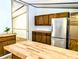 Bright kitchen features butcher block countertops, stainless steel appliances and wood cabinets at 1705 Old Nc 10 Hwy, Hillsborough, NC 27278