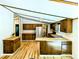 Bright kitchen featuring updated cabinets, butcher block countertops, and stainless steel appliances at 1705 Old Nc 10 Hwy, Hillsborough, NC 27278