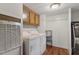 Functional laundry room with washer, dryer, and storage cabinets at 1705 Old Nc 10 Hwy, Hillsborough, NC 27278