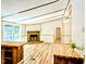 Open floor plan showcases a stone fireplace, wood floors, and kitchen with butcher block countertops at 1705 Old Nc 10 Hwy, Hillsborough, NC 27278
