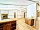 Bright open-concept living room featuring wood floors and a stone fireplace and butcher block countertops at 1705 Old Nc 10 Hwy, Hillsborough, NC 27278
