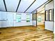 Open living area featuring bright wood floors, neutral walls, and large windows at 1705 Old Nc 10 Hwy, Hillsborough, NC 27278