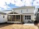 A charming two-story home with a screened in porch and gray siding on a cloudy day at 1804 Bright Lantern Way, Wendell, NC 27591