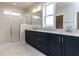 Bathroom features double vanity, tiled shower, and tile floors at 1804 Bright Lantern Way, Wendell, NC 27591