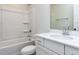 White bathroom with a tub, chrome fixtures, white marble countertop and cabinets at 1804 Bright Lantern Way, Wendell, NC 27591