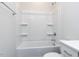 All white bathroom, featuring a tub and shower combo with a toilet on the side at 1804 Bright Lantern Way, Wendell, NC 27591