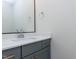 Modern half-bathroom with a sleek vanity, stylish faucet, and a framed mirror at 1804 Bright Lantern Way, Wendell, NC 27591