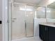 Bathroom features a glass shower door, white subway tile, and granite counters at 1804 Bright Lantern Way, Wendell, NC 27591