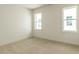 Bedroom featuring neutral carpet and two windows providing lots of natural light at 1804 Bright Lantern Way, Wendell, NC 27591