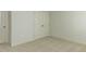 Bedroom featuring neutral carpeting and closet doors at 1804 Bright Lantern Way, Wendell, NC 27591