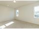 Bright bedroom featuring plush carpeting and large windows for ample natural light at 1804 Bright Lantern Way, Wendell, NC 27591