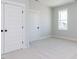 Bedroom featuring neutral paint, carpet, white trim, and a set of double closets at 1804 Bright Lantern Way, Wendell, NC 27591