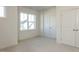 Bright bedroom with large windows and a double-door closet, perfect for storage at 1804 Bright Lantern Way, Wendell, NC 27591
