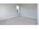 Bedroom featuring neutral paint, carpet, white trim, and a window at 1804 Bright Lantern Way, Wendell, NC 27591