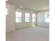 Large bonus room with neutral carpet and plenty of natural light at 1804 Bright Lantern Way, Wendell, NC 27591