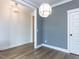 Dining room featuring modern lighting, neutral wall colors, and light-colored wood flooring at 1804 Bright Lantern Way, Wendell, NC 27591