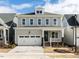 Charming two-story home with gray siding, attached garage, and inviting front porch at 1804 Bright Lantern Way, Wendell, NC 27591