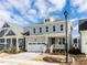 Beautiful two-story home with a two-car garage, gray siding, and inviting front porch at 1804 Bright Lantern Way, Wendell, NC 27591