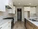 Modern kitchen features granite counters, stainless steel appliances, subway tile backsplash, and wood-look floors at 1804 Bright Lantern Way, Wendell, NC 27591