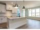 Bright kitchen features white cabinets, granite countertops and stainless steel appliances at 1804 Bright Lantern Way, Wendell, NC 27591