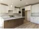 Beautiful kitchen featuring white cabinets, granite countertops, stainless appliances, and a large island at 1804 Bright Lantern Way, Wendell, NC 27591