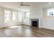 Spacious living room with fireplace, built-ins, and large windows for natural light at 1804 Bright Lantern Way, Wendell, NC 27591