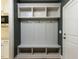 Mudroom with a built-in bench, storage cubbies, and coat hooks at 1804 Bright Lantern Way, Wendell, NC 27591