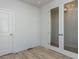 Home office featuring a glass door, laminate floor, and ample natural light from the window at 1804 Bright Lantern Way, Wendell, NC 27591