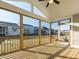 Spacious screened porch with wood flooring and plenty of natural light and overhead fan at 1804 Bright Lantern Way, Wendell, NC 27591