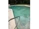 A closer view of the in-ground pool and the pool entry steps at 209 N Watauga Ave, Dunn, NC 28334
