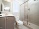 Bathroom with a glass shower, gray tile, and a modern vanity at 503 Bendemeer Ln, Rolesville, NC 27571