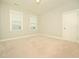 Cozy carpeted bedroom with two windows at 503 Bendemeer Ln, Rolesville, NC 27571