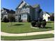Two-story house with gray siding, stone accents, and a landscaped lawn at 503 Bendemeer Ln, Rolesville, NC 27571