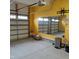 Spacious garage with overhead storage and mirror at 503 Bendemeer Ln, Rolesville, NC 27571